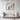Sunlit Bloom on Mediterranean Balcony Framed Canvas (Walnut) / 48 x 32