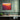 Fiery Sunset Over Crimson Hills Framed Canvas (Black) / 20 x 16