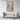 Radiant Cardinal Amidst Blossoming Branches Framed Canvas (Black) / 32 x 48
