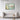 Enchanted Flight over Floral Waters Framed Canvas (Black) / 48 x 32