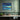 Twilight Reflections over Urban Waters Framed Canvas (Black) / 48 x 32